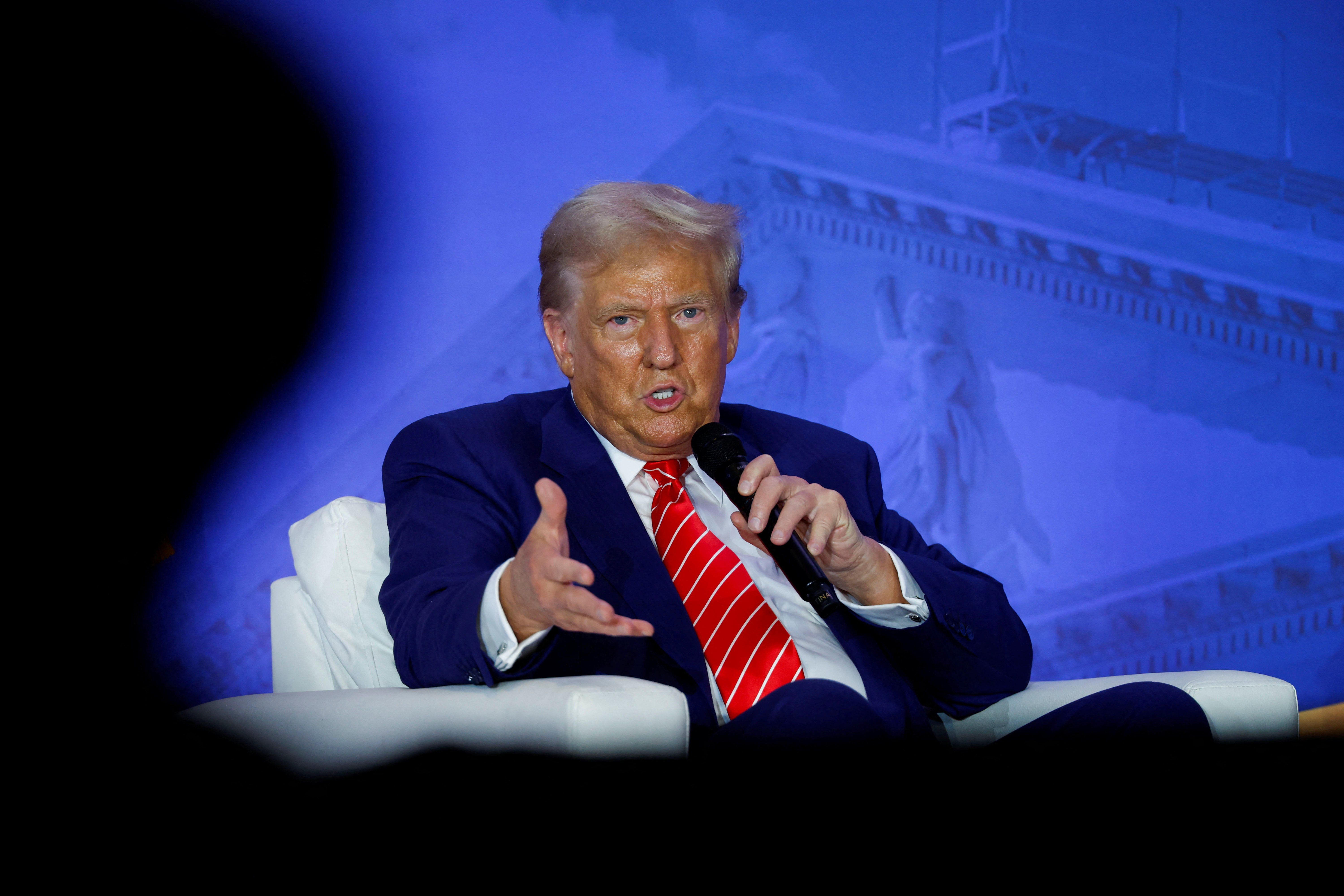 epublican presidential nominee and former U.S. President Donald Trump participates in a fireside chat during the Moms for Liberty National "Joyful Warriors" Summit, in Washington, U.S., August 30, 2024. 