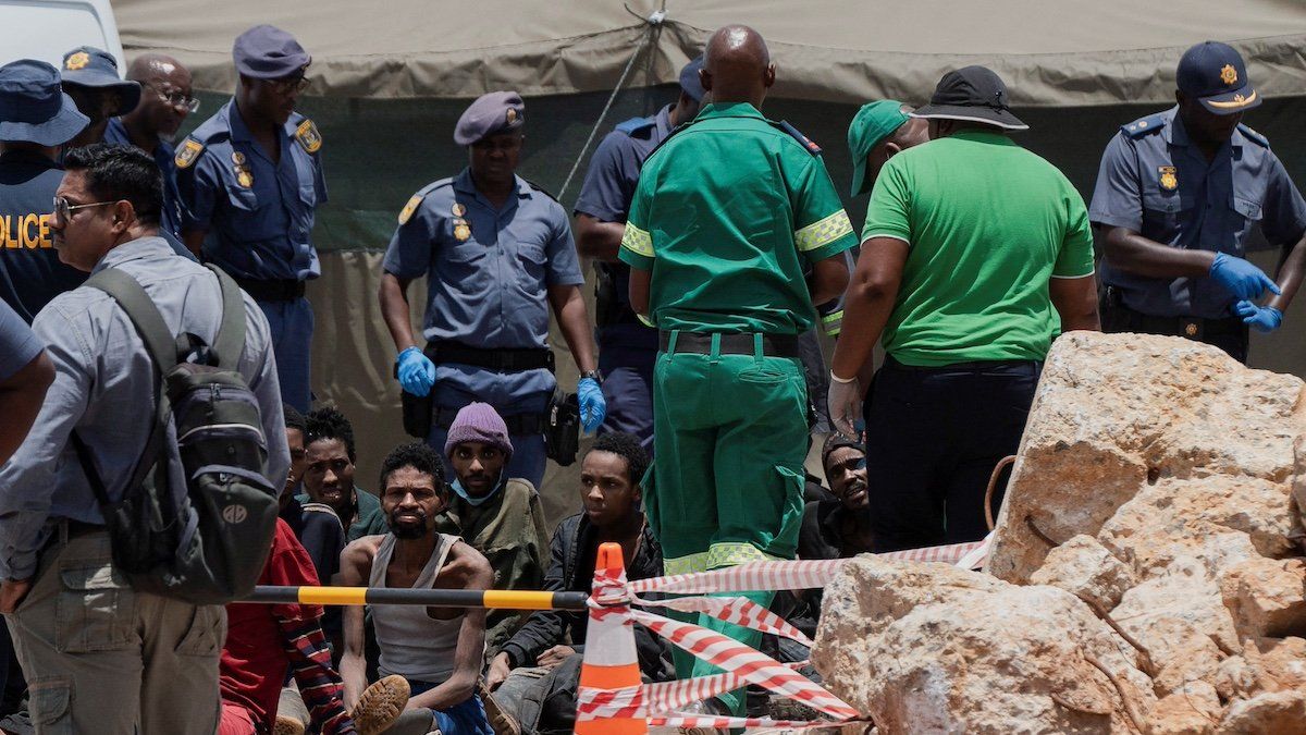 Rescued miners are seen as they are processed by police after being rescued at the mine shaft where rescue operations are ongoing as attempts are made to rescue illegal miners who have been underground for months, in Stilfontein, South Africa, January 14, 2025. 