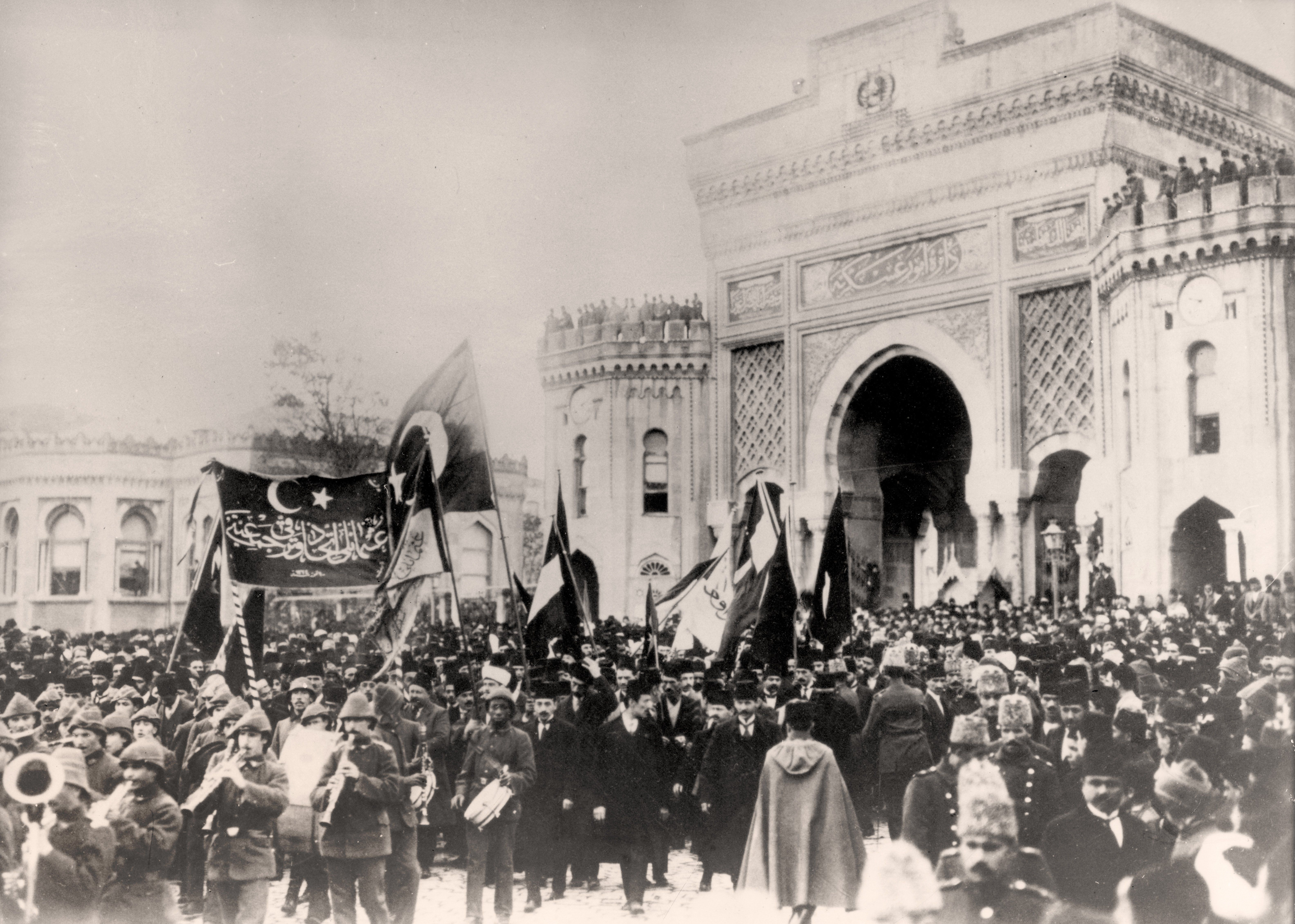 Residents of Constantinople (today: Istanbul, Turkey) celebrate the entry into World War I of the Ottoman Empire in front of the Ministry of War