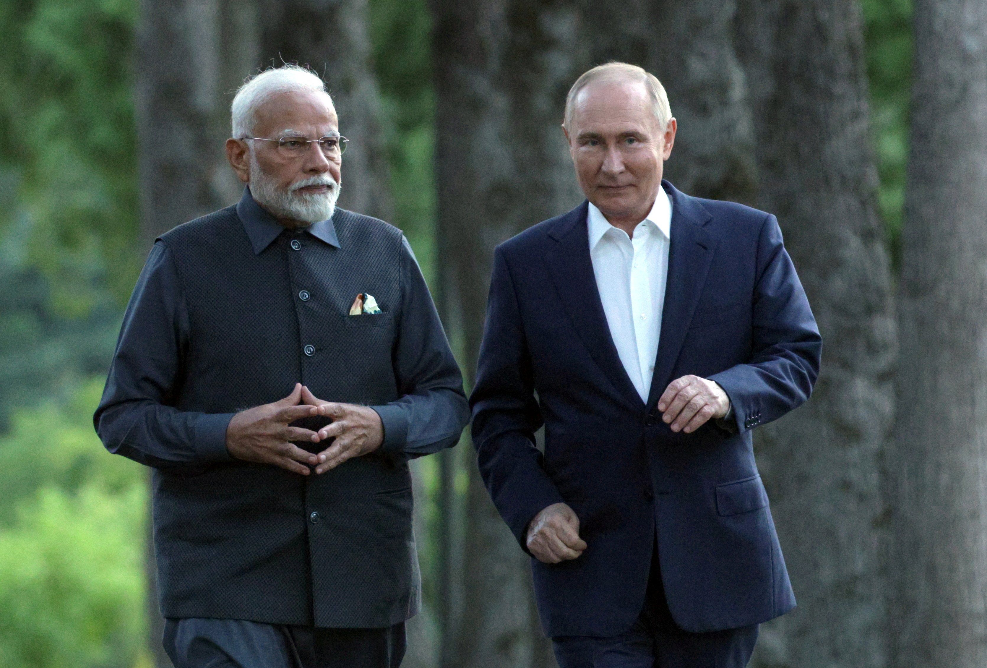 Russia's President Vladimir Putin and India's Prime Minister Narendra Modi walk during their meeting at the Novo-Ogaryovo state residence near Moscow, Russia July 8, 2024. 