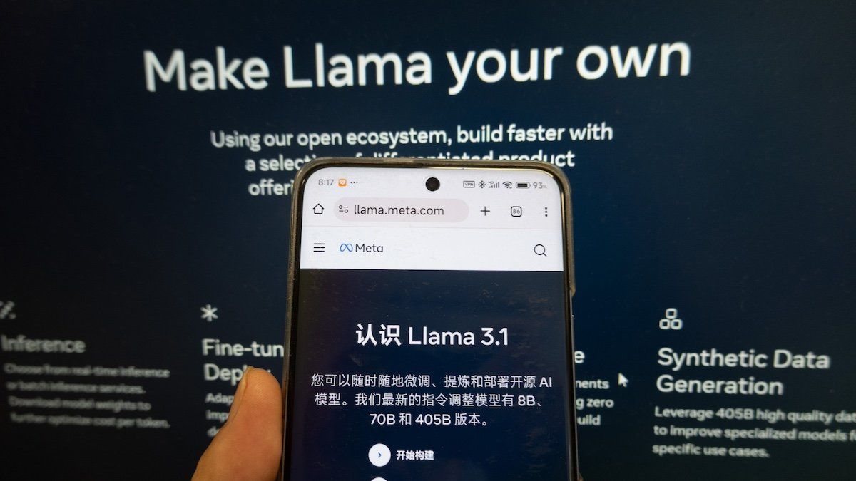 SHANGHAI, CHINA - JULY 25, 2024 - A young man looks at the page of Meta's Llama 3.1 open source AI model on his mobile phone and computer in Shanghai, China, July 25, 2024.