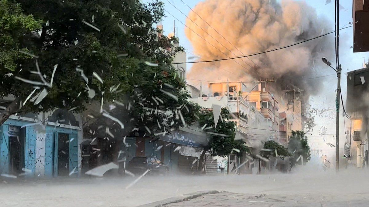 ​Smoke rises following an Israeli strike on a residential building, amid the ongoing conflict between Israel and Hamas, Nuseirat in the central Gaza Strip, in this screen grab taken from a video, August 18, 2024. 