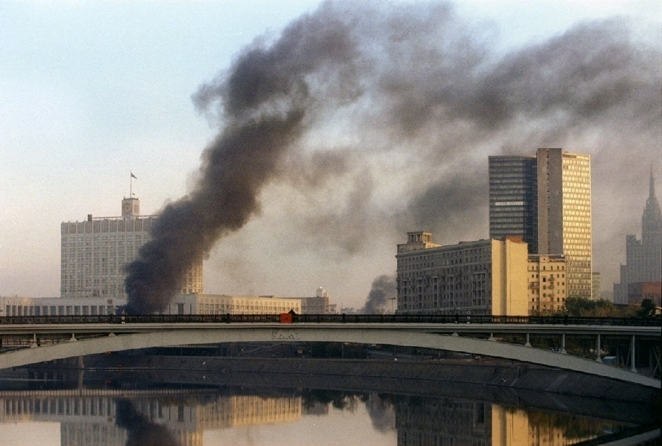 Smoke rises from the White House parliament building as Yeltsinist troops storm the Russian parliament October 4, 1993.