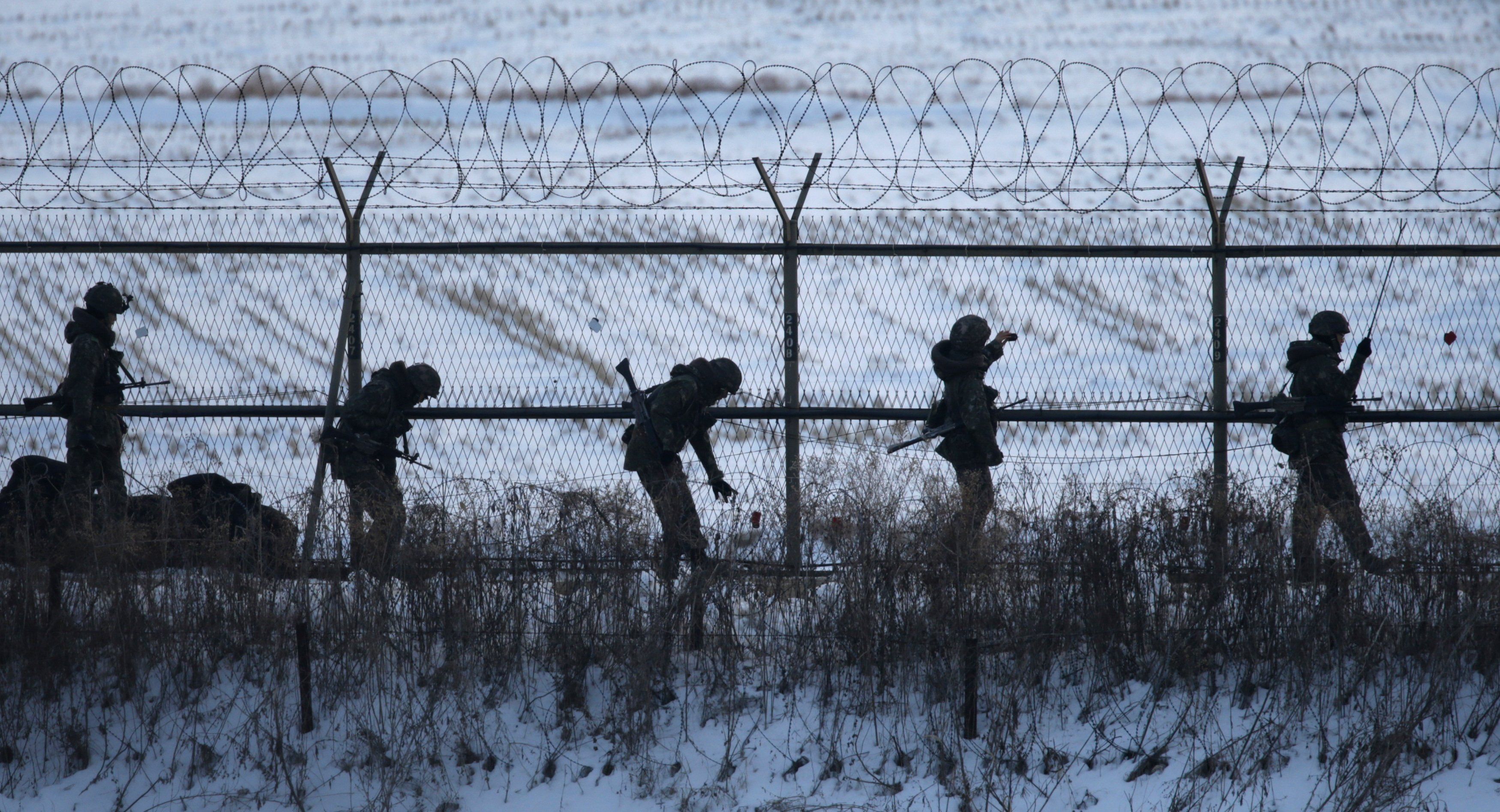 South Korean soldiers check military fences as they patrol near the demilitarized zone separating North Korea from South Korea, in Paju, north of Seoul February 12, 2013.