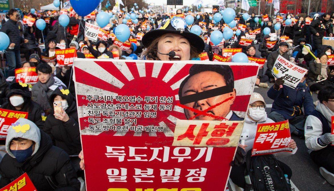 South Koreans hold a mass rally demanding the impeachment and imprisonment of President Yoon Suk-Yeol near the National Assembly in Seoul, South Korea, on Dec. 7. 