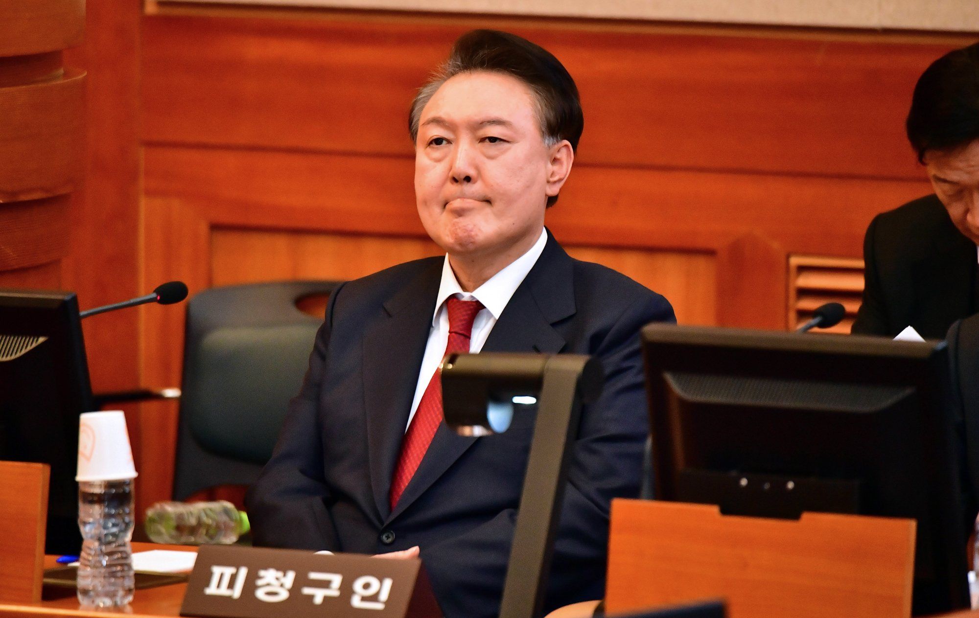 ​South Korea's impeached President Yoon Suk Yeol attends a hearing of his impeachment trial at the Constitutional Court in Seoul, South Korea, February 20, 2025. 