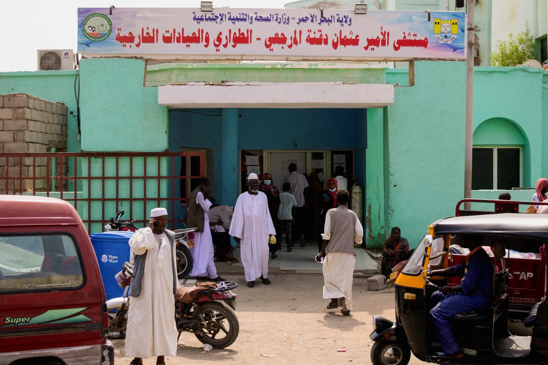 Sudanese families wait outside a hospital while doctors and medical staff strike to protest late salaries, bringing the struggling health sector in the city of Port Sudan to almost a complete halt as thousands of displaced Sudanese flooded the city due to the raging war in Khartoum, Sudan, August 20, 2023. 