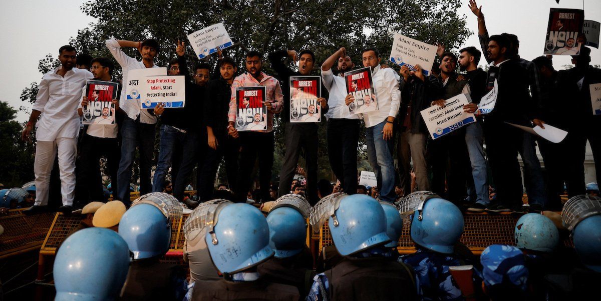 ​Supporters of India's main opposition Congress party hold placards during a protest against Indian billionaire Gautam Adani, after he was indicted in New York over his role in an alleged multibillion-dollar bribery and fraud scheme, in New Delhi, India, November 21, 2024. 