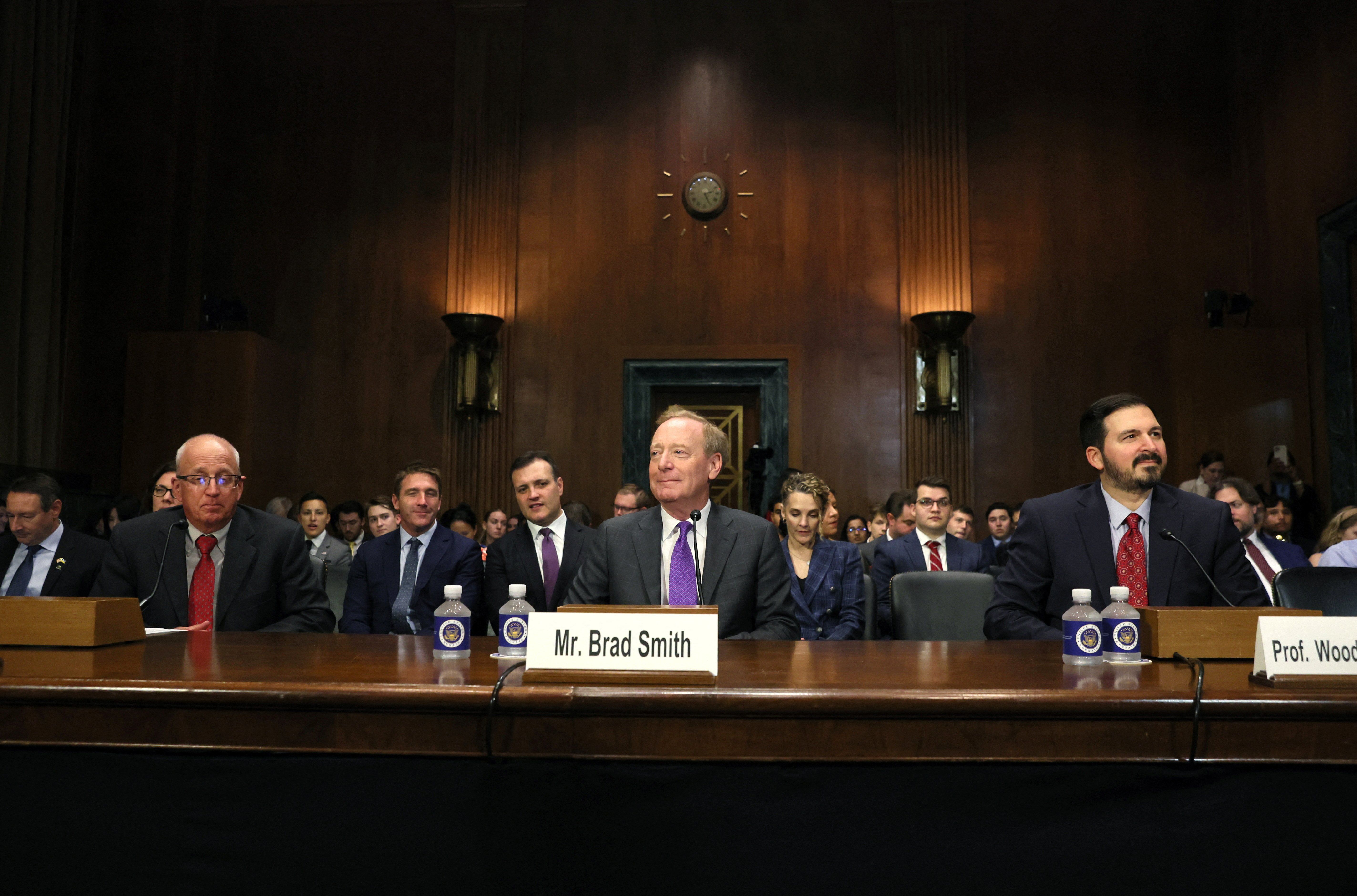 Tech leaders testifying on Capitol Hill. 