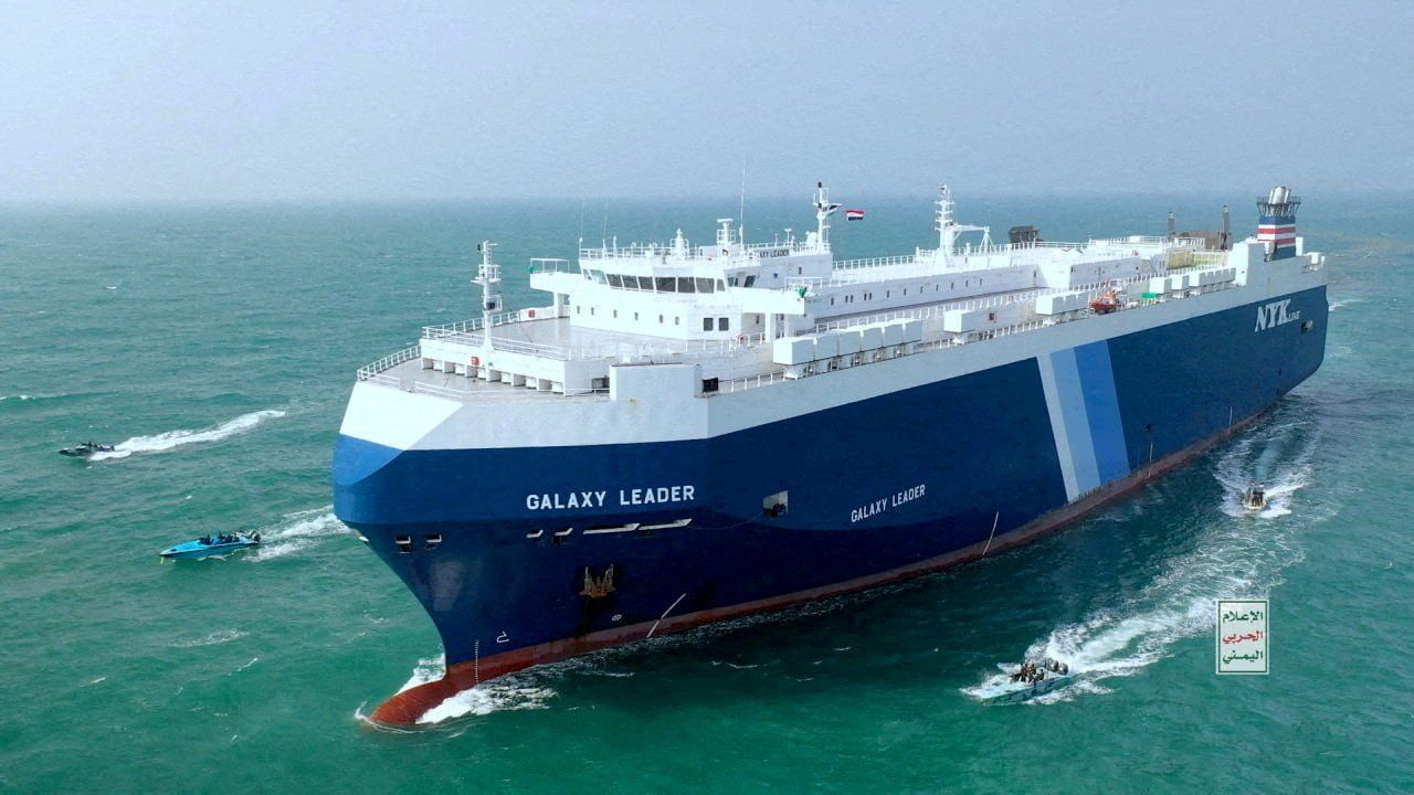  The Galaxy Leader cargo ship is escorted by Houthi boats in the Red Sea.