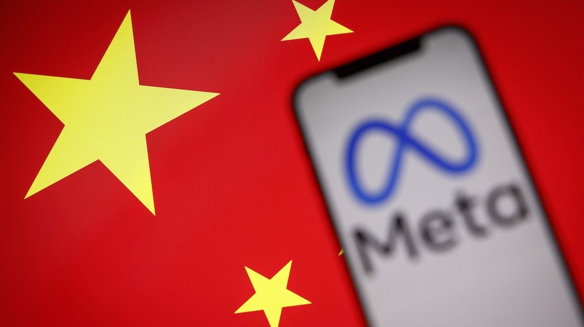 ​The Meta logo is seen on a mobile phone with the Chinese flag in the background in this photo illustration.