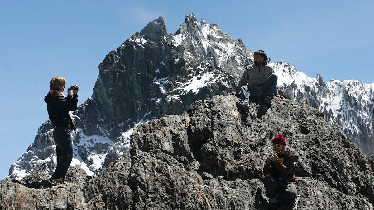 Tourist stand in front of Peak Bolivar at the Sierra Nevada in the Andean state of Merida July 30, 2008.