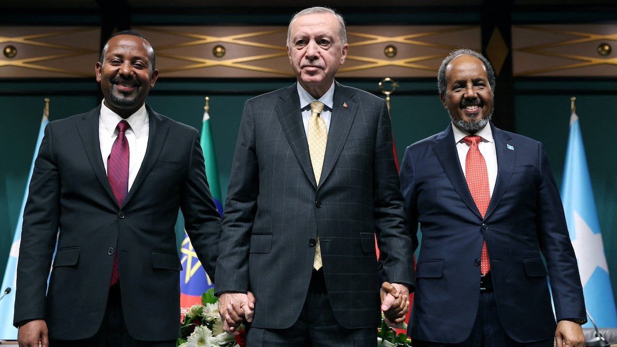 Turkish President Tayyip Erdogan poses with Somali President Hassan Sheikh Mohamud and Ethiopian Prime Minister Abiy Ahmed following a press conference in Ankara, Turkey, December 11, 2024. 