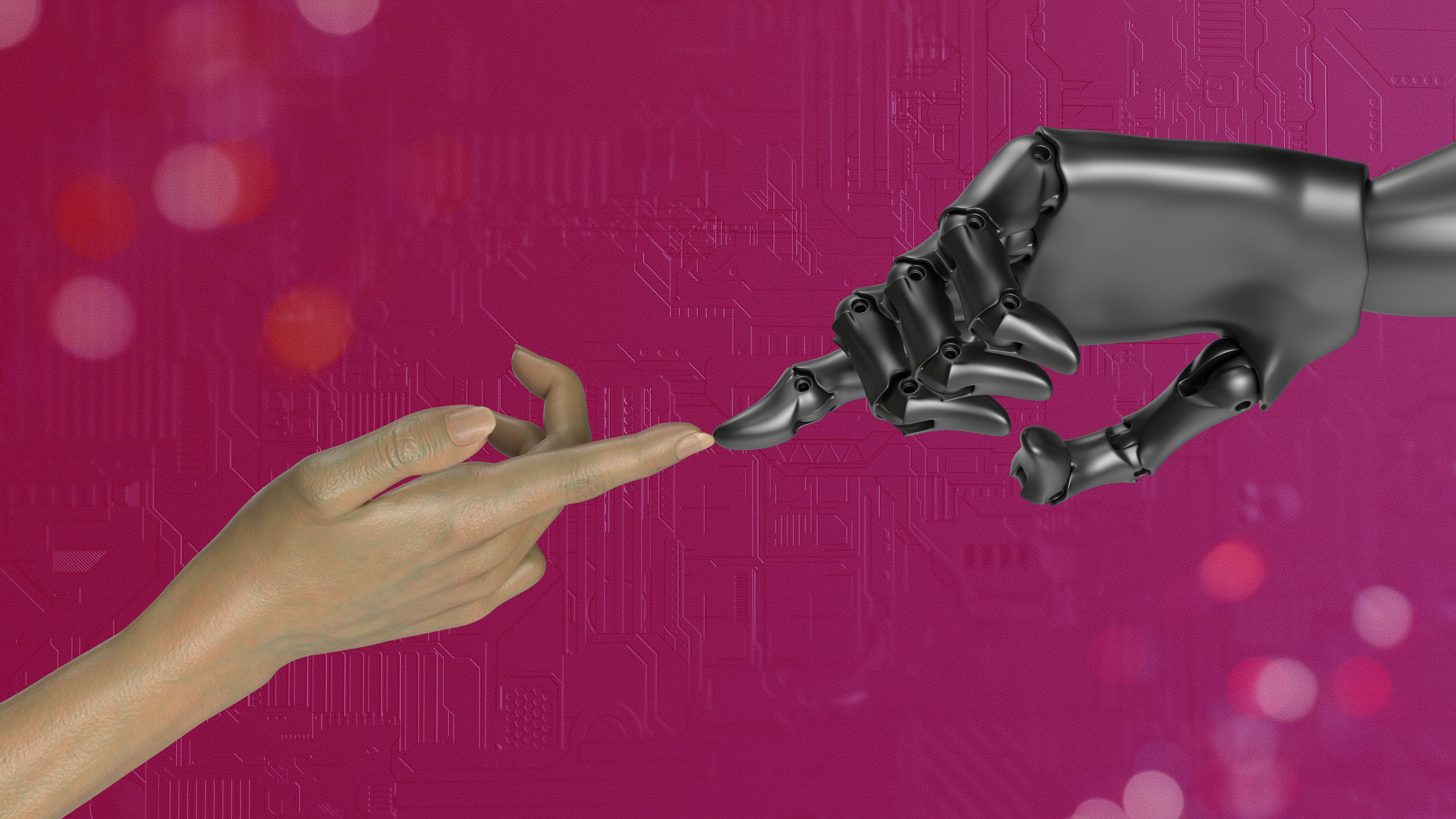 Two hands, one human and one robotic, touching each other in front of a pink background.