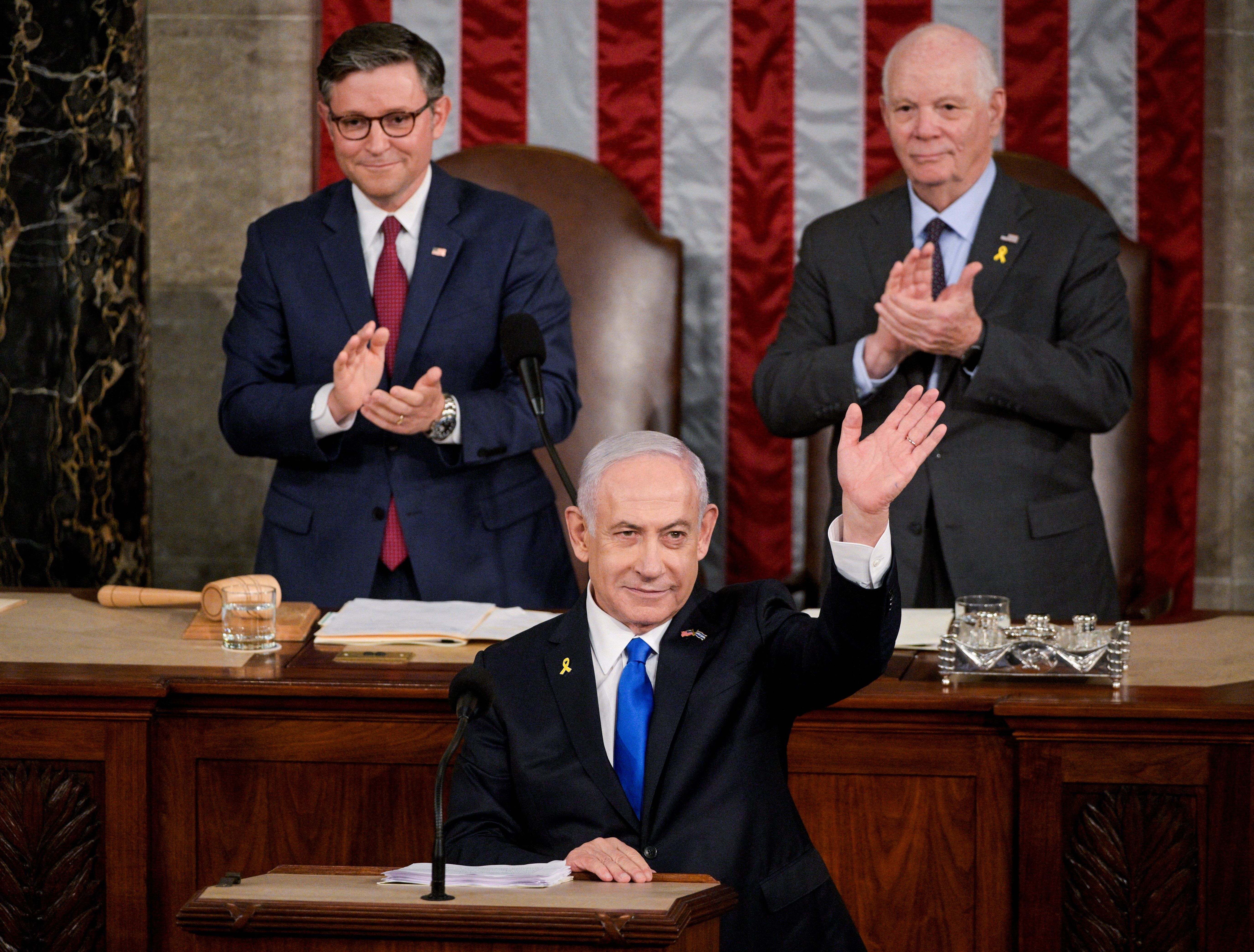 ​U.S. House Speaker Mike Johnson (R-LA) and Senate Foreign Relations Chair, Senator Ben Cardin (D-MD), applaud as Israeli Prime Minister Benjamin Netanyahu addresses a joint meeting of Congress at the U.S. Capitol in Washington, U.S., July 24, 2024. 