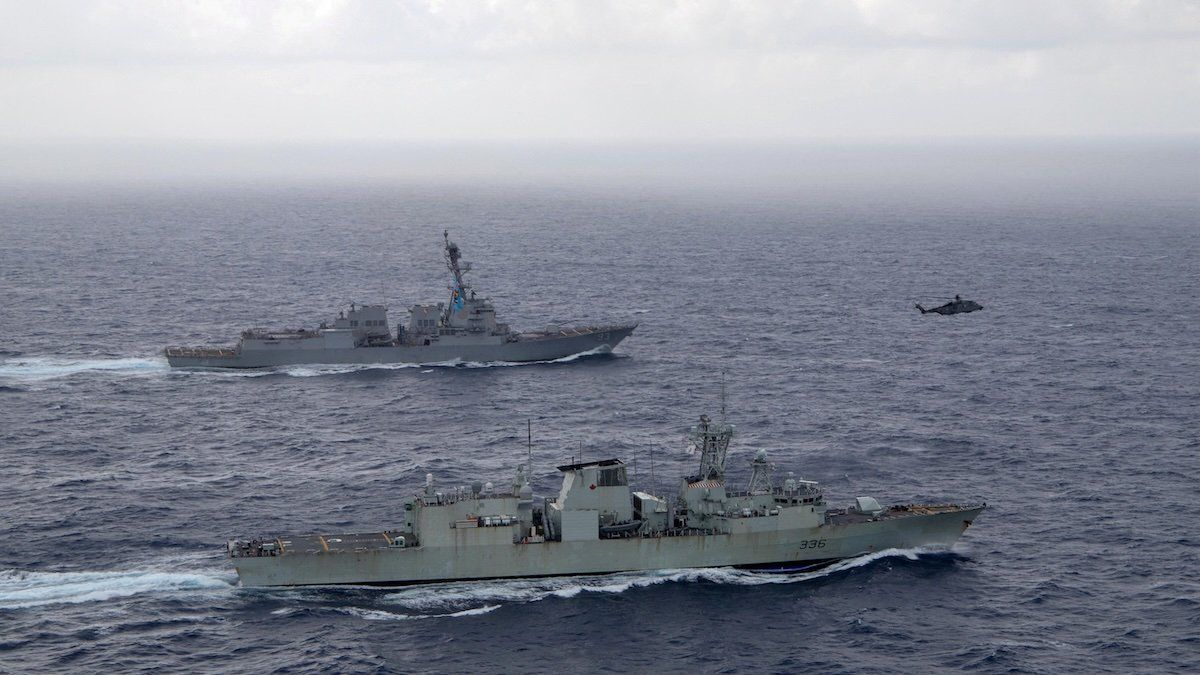 U.S. Navy guided-missile destroyer USS Chung-Hoon sails alongside the Royal Canadian Navy frigate HMCS Montreal during Surface Action Group operations as a part of exercise “Noble Wolverine" in the South China Sea May 30, 2023.