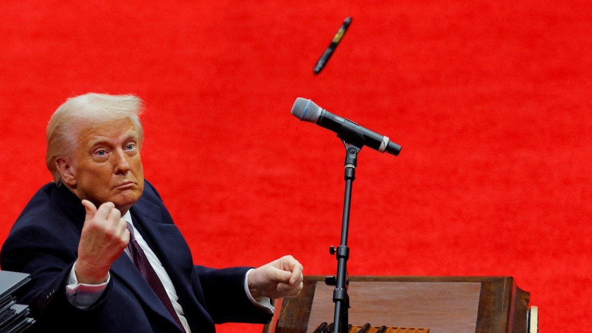 ​U.S. President Donald Trump throws a pen after he signed executive orders on the inauguration day of Trump's second Presidential term, inside Capital One Arena, in Washington, U.S. January 20, 2025. 