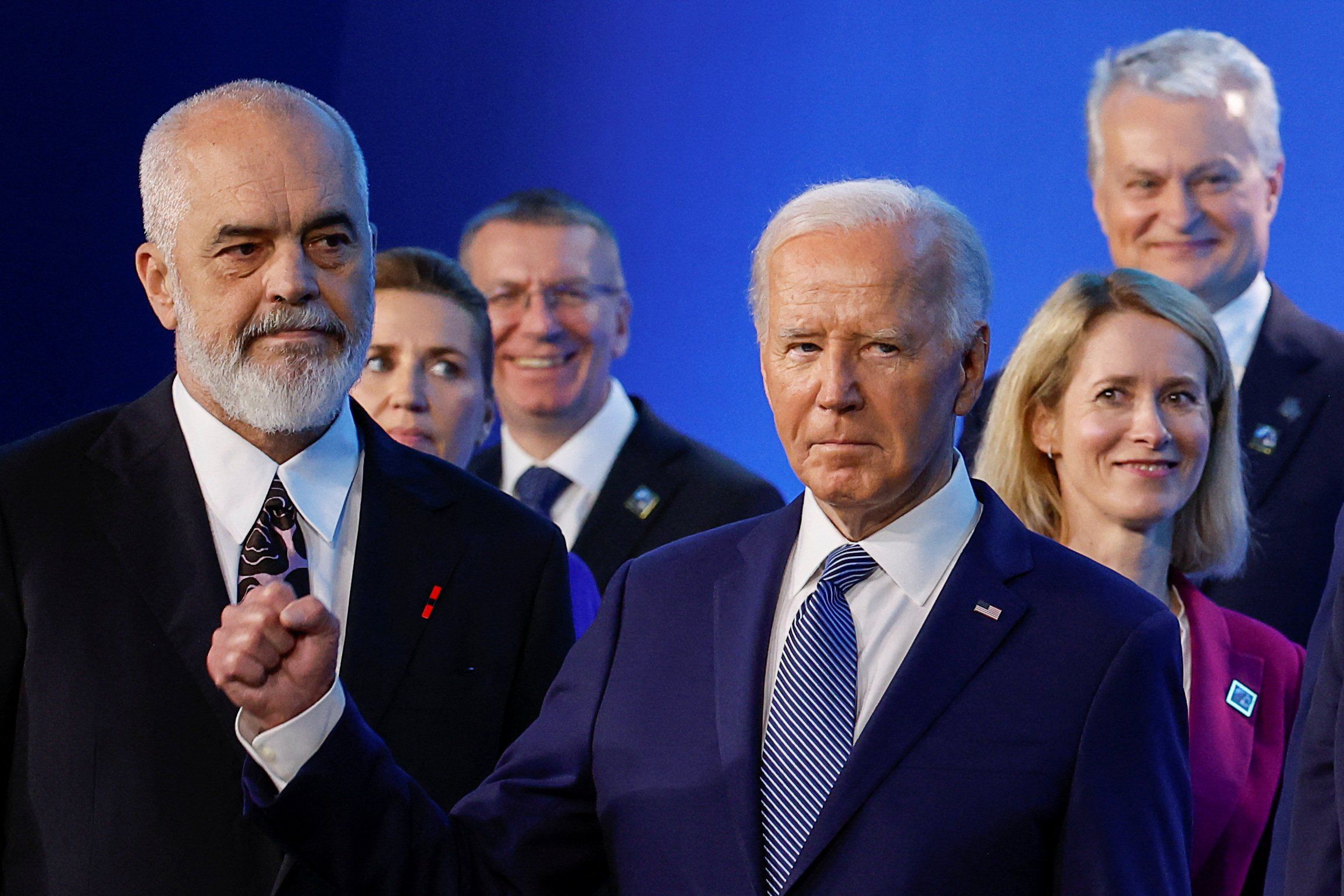 U.S. President Joe Biden gestures, as he and Estonia's Prime Minister Kaja Kallas, Lithuania's President Gitanas Nauseda and Albania's Prime Minister Edi Rama attend NATO's 75th anniversary summit in Washington, U.S., July 10, 2024. 