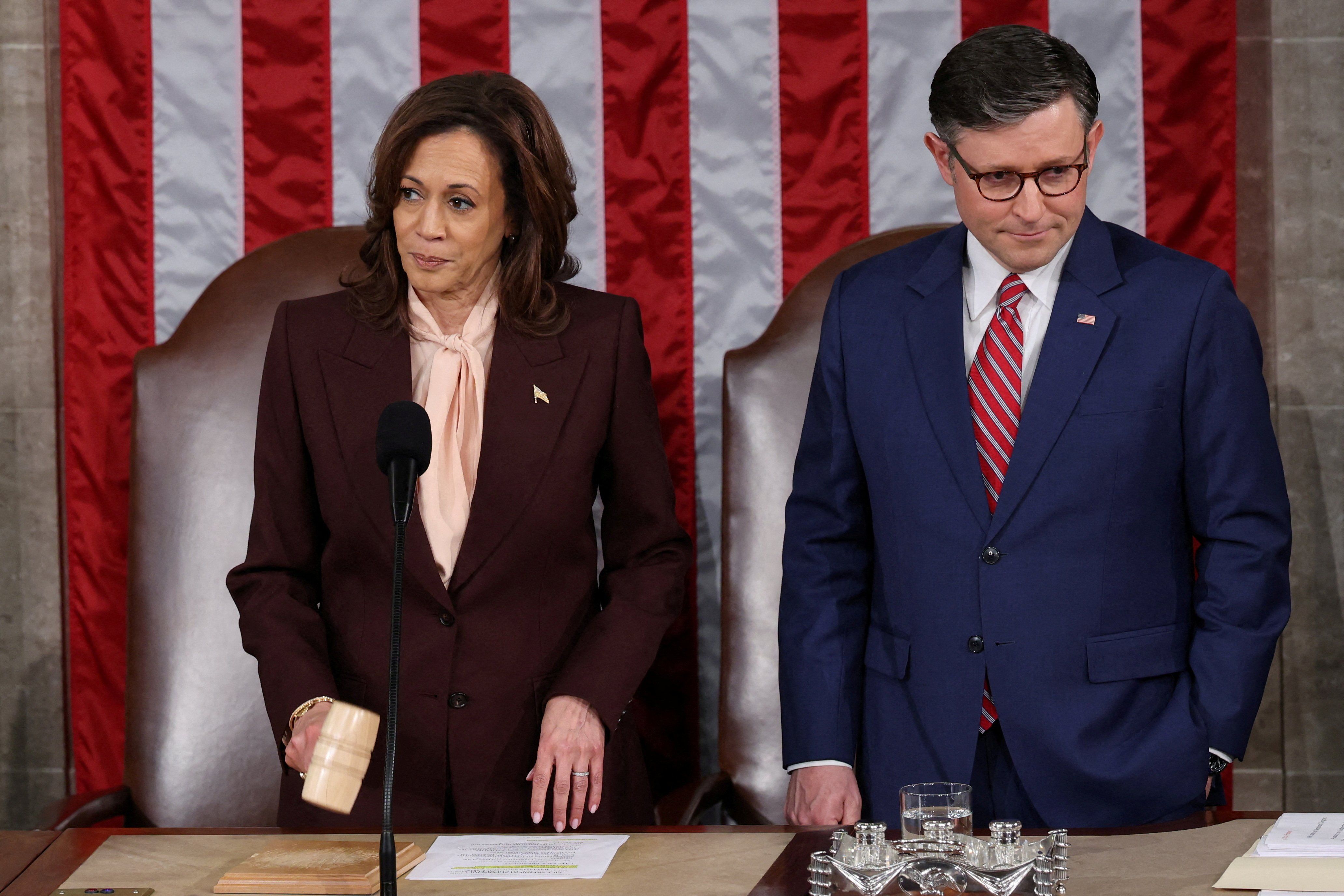 ​U.S. Vice President Kamala Harris affirms the certification of Donald Trump's election, next to Speaker of the House Mike Johnson (R-LA), during a joint session of Congress to certify Trump's election, at the U.S. Capitol in Washington, U.S. January 6, 2025. 