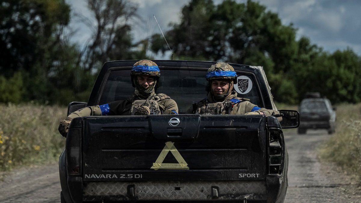 Ukrainian servicemen ride a military vehicle, amid Russia's attack on Ukraine, near the Russian border in Sumy region, Ukraine August 13, 2024.