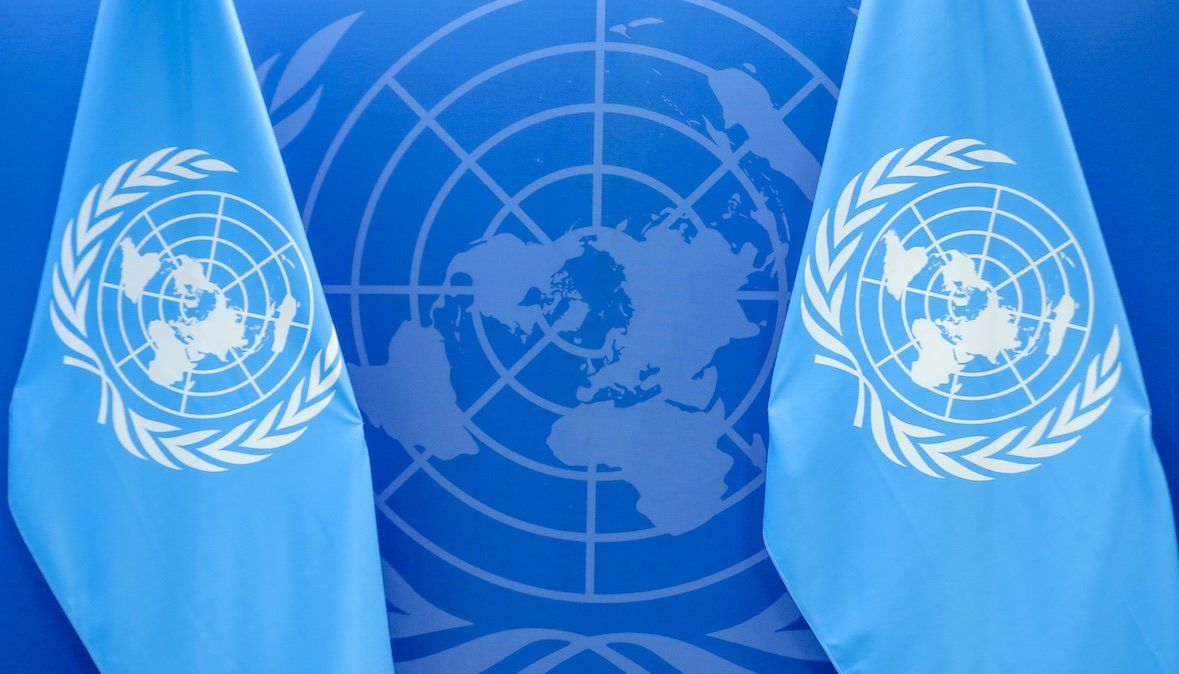 UN flags and logo.