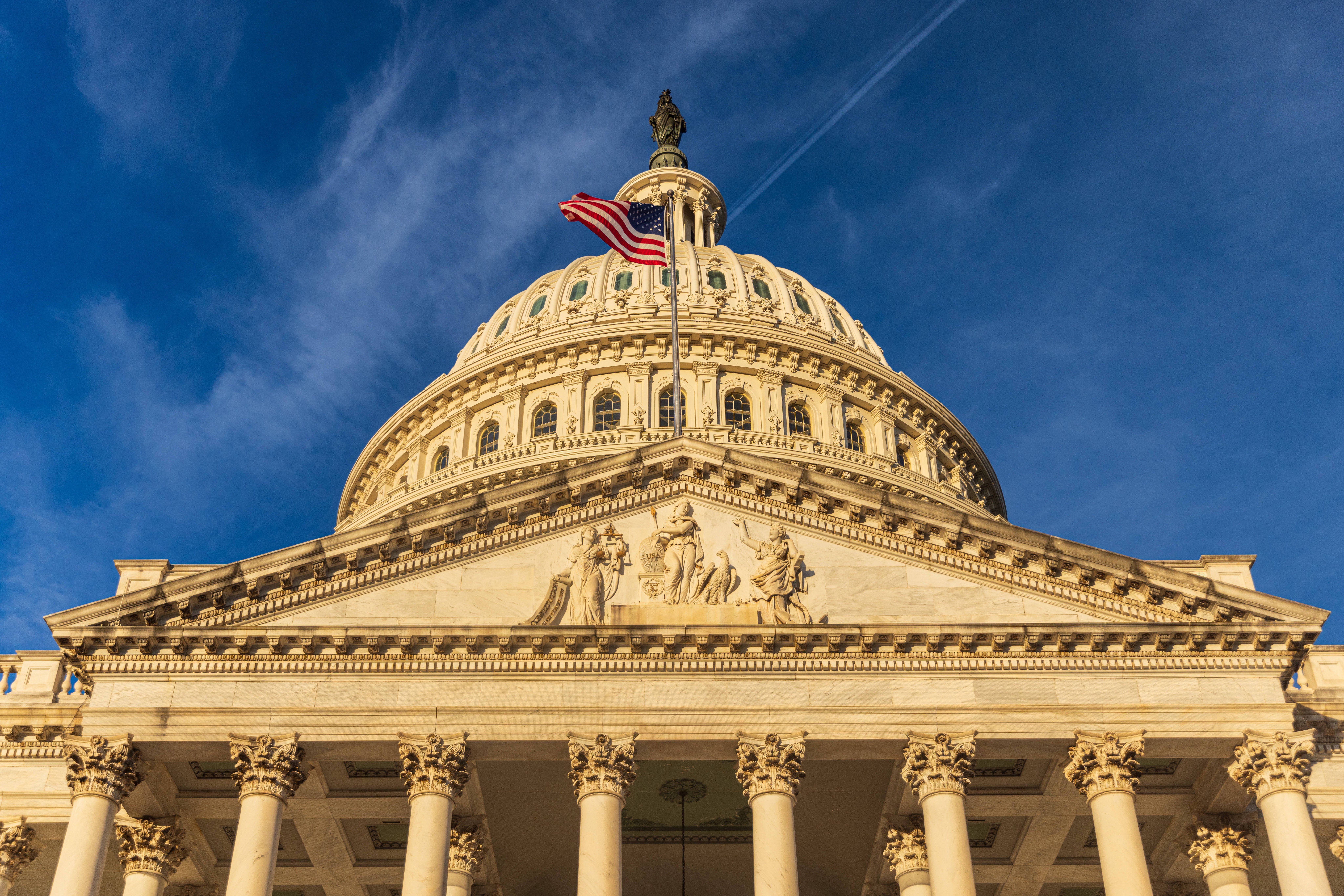 ​US Capitol building at in the morning sun. Washington DC, USA The US Capitol building in the early morning at sunset.