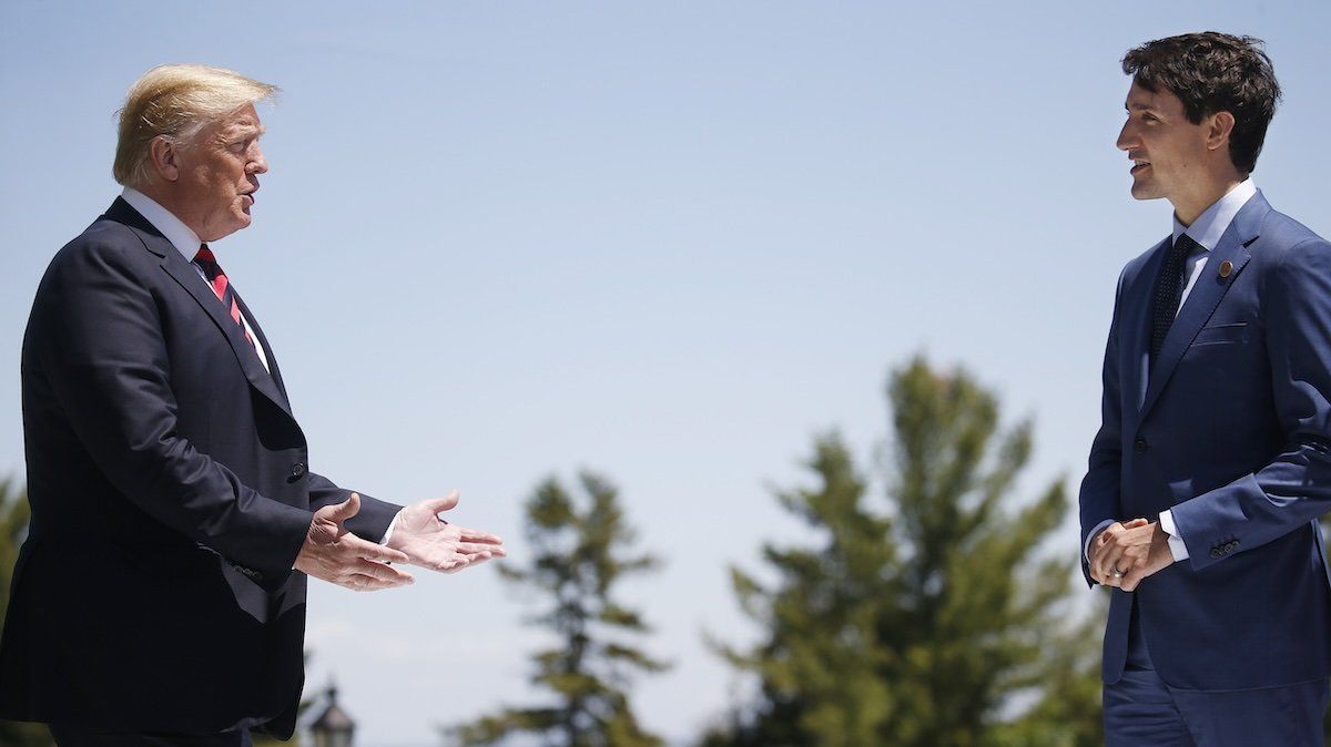 US President Donald Trump approaches Canada's Prime Minister Justin Trudeau as he arrives at the G7 Summit in Charlevoix, Quebec, Canada, June 8, 2018. 