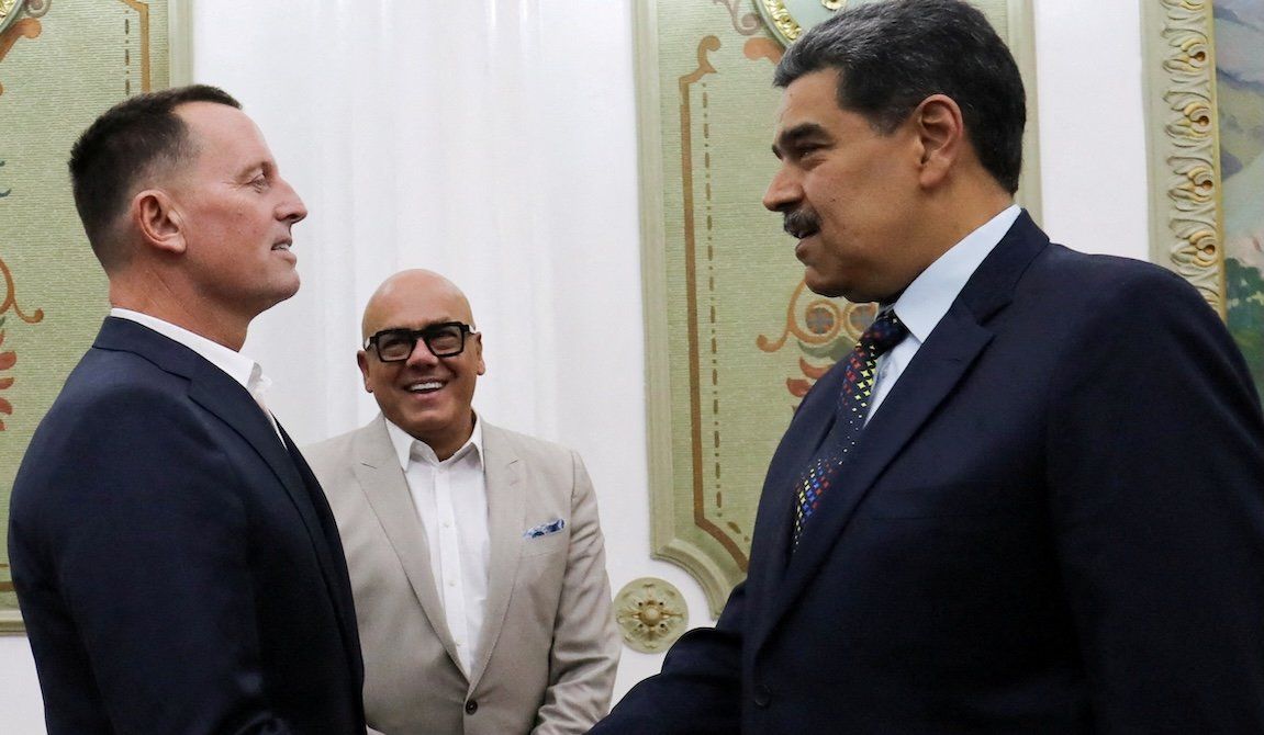 Venezuela's President Nicolas Maduro, right, and President Donald Trump's envoy Richard Grenell shake hands at the Miraflores Palace, in Caracas, Venezuela, on Jan. 31, 2025. 