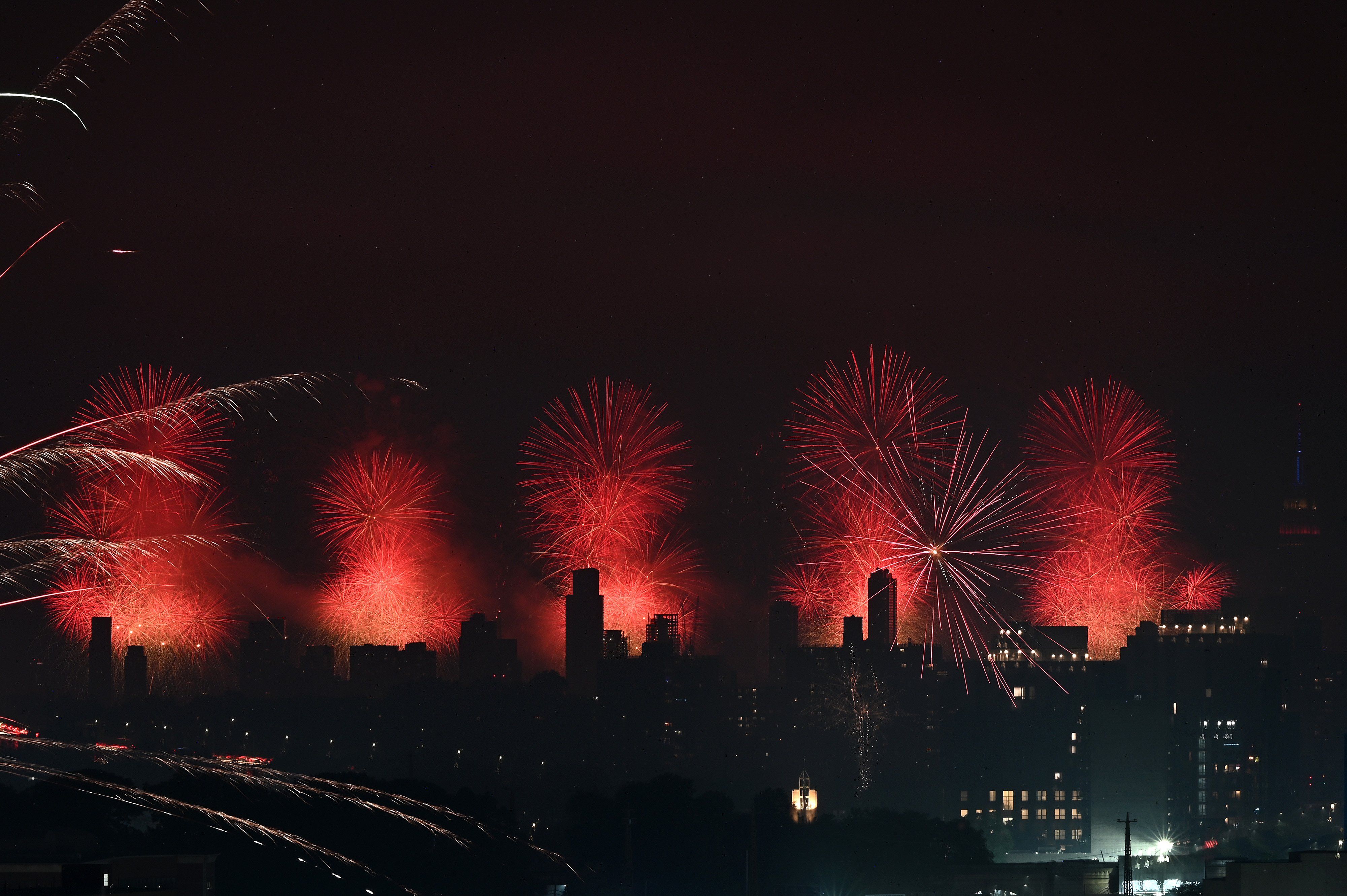 View Macy’s Fourth of July fireworks, from the Queens borough of New York, NY.