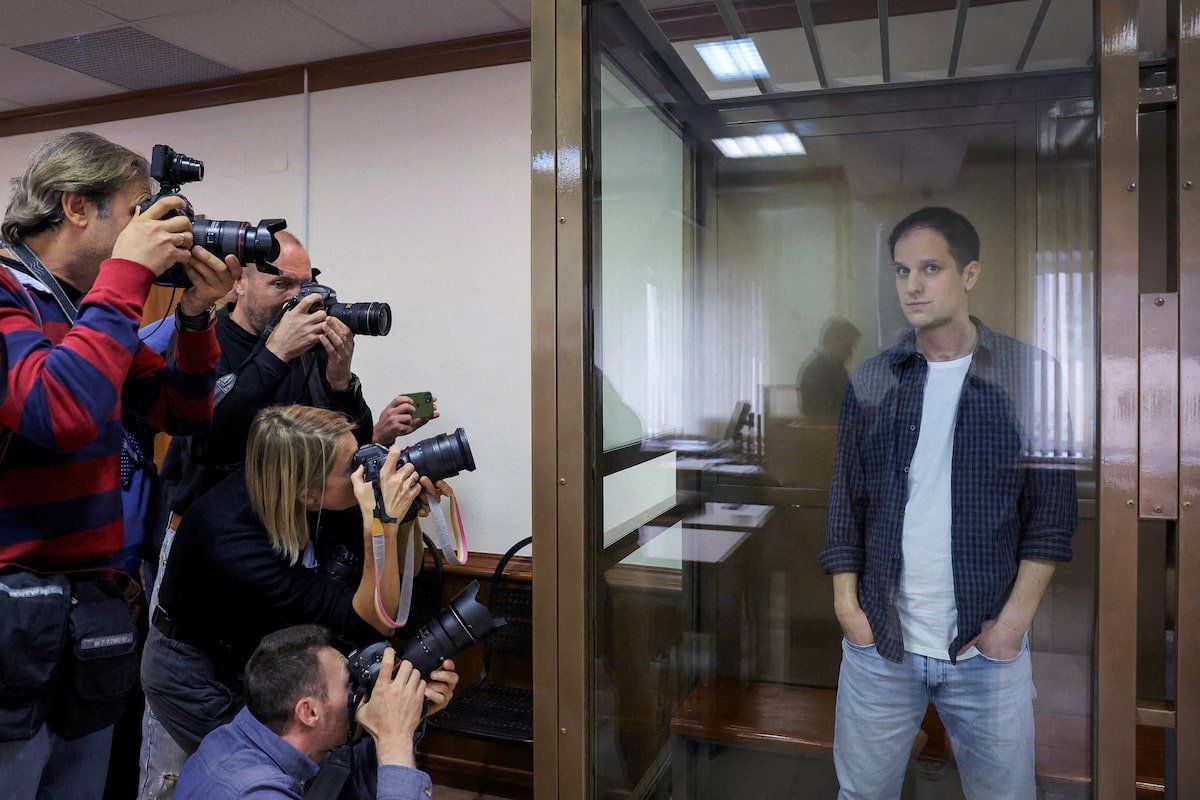 Wall Street Journal reporter Evan Gershkovich stands inside an enclosure for defendants before a court hearing to consider an appeal against his pre-trial detention on espionage charges in Moscow, Russia, October 10, 2023. 