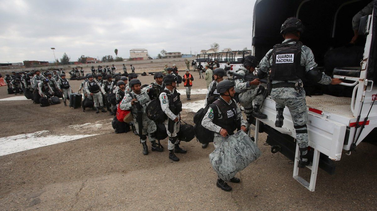 ​Members of Mexico's National Guard queue to board a vehicle upon disembarking from a plane, after Mexican President Claudia Sheinbaum agreed with U.S. President Donald Trump to bolster border enforcement efforts in response to Trump's demand to crack down on immigration and drug smuggling, in Tijuana, Mexico, on Feb. 4, 2025. 