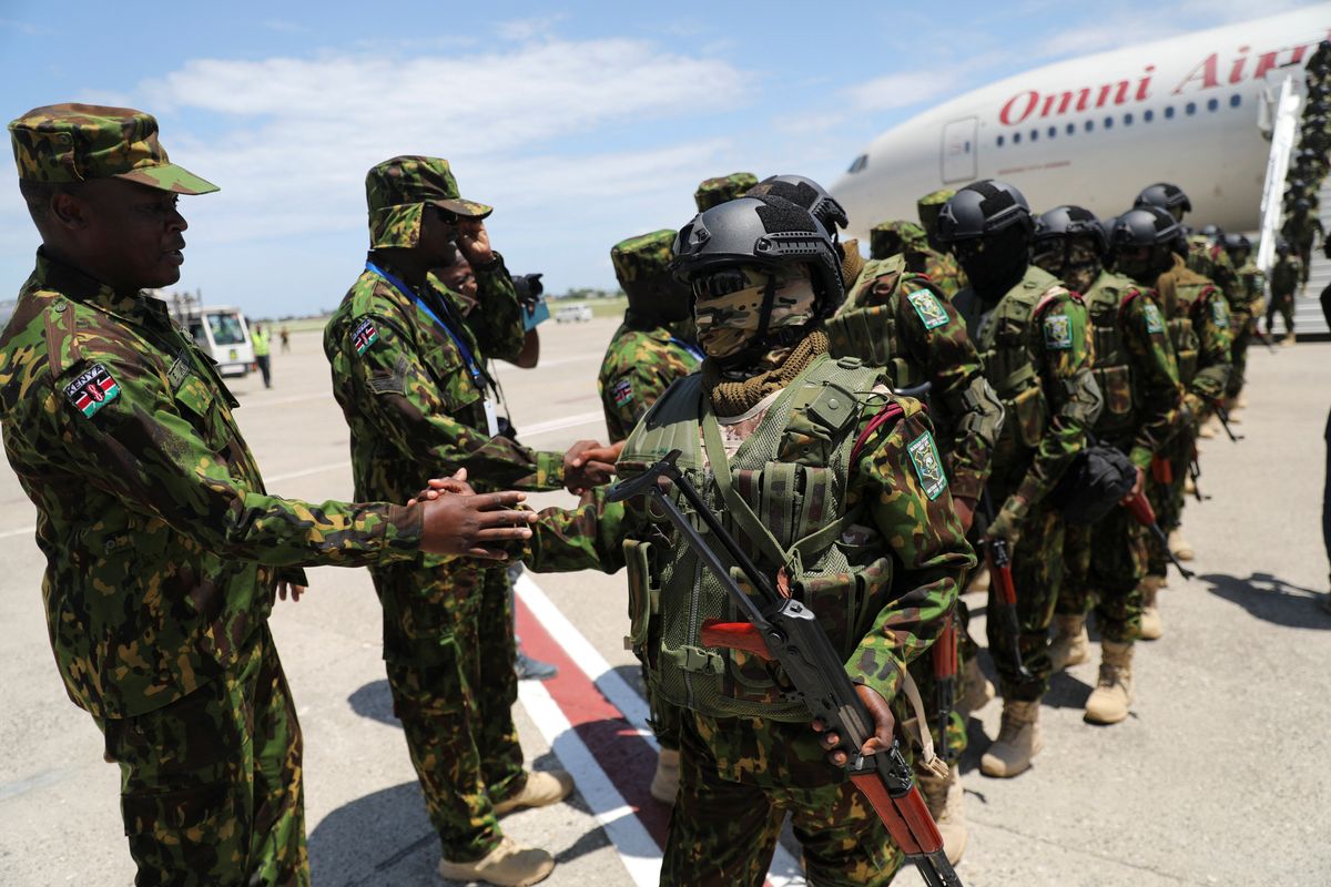 ​Members of the second contingent of Kenyan police greet each other after arriving in the Caribbean country as part of a peacekeeping mission, in Port-au-Prince, Haiti July 16, 2024. 