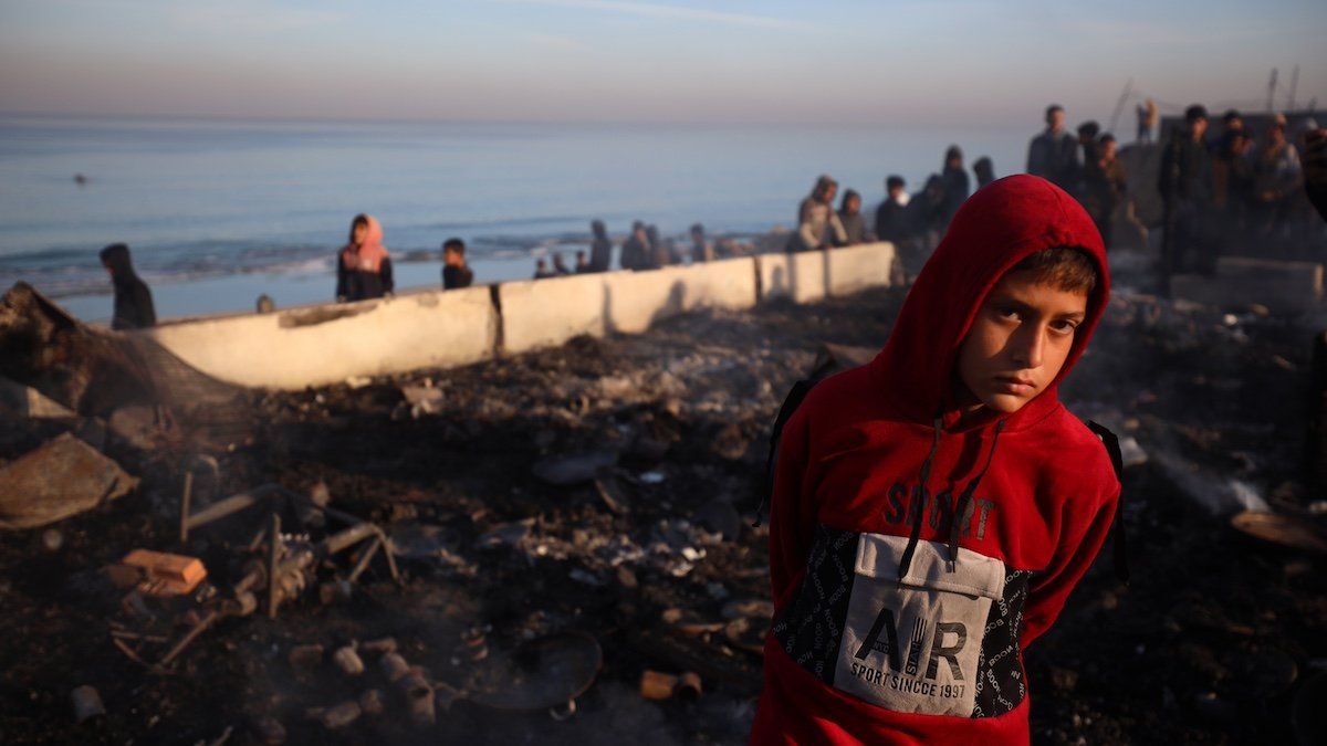 Palestinians inspect the site of an Israeli strike on a beachfront cafe amid the ongoing conflict between Israel and Hamas in Deir Al-Balah, Gaza Strip, on January 14, 2025. 