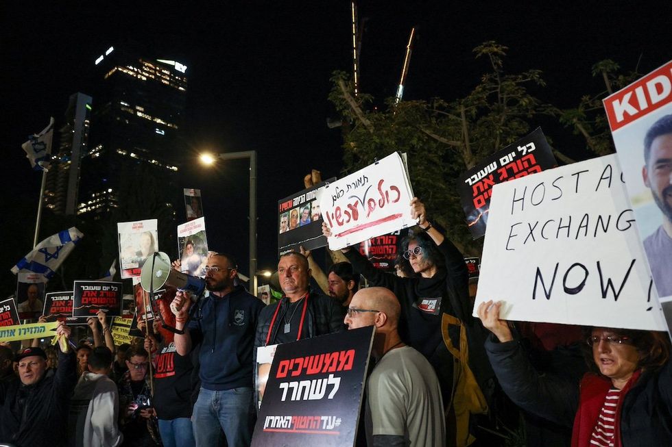People protest following an announcement by Israel's military that they had mistakenly killed three Israeli hostages being held in Gaza by Palestinian Islamist group Hamas, at a demonstration in Tel Aviv, Israel, December 15, 2023.