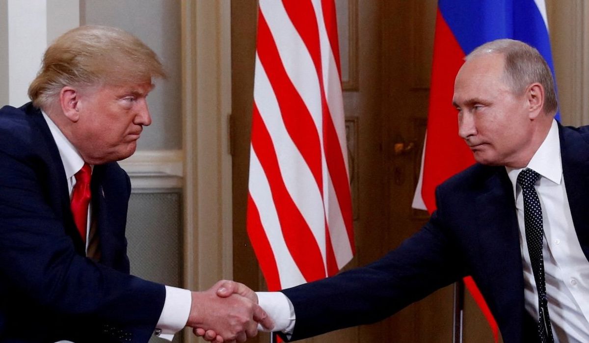 President Donald Trump and Russian President Vladimir Putin shake hands as they meet in Helsinki, Finland, in July 2018.