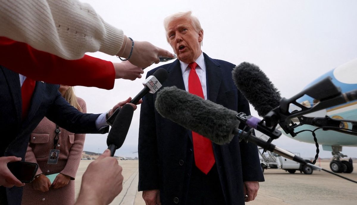 ​President Donald Trump speaks to reporters before boarding Air Force One as he departs from Joint Base Andrews in Maryland, on March 14, 2025. 