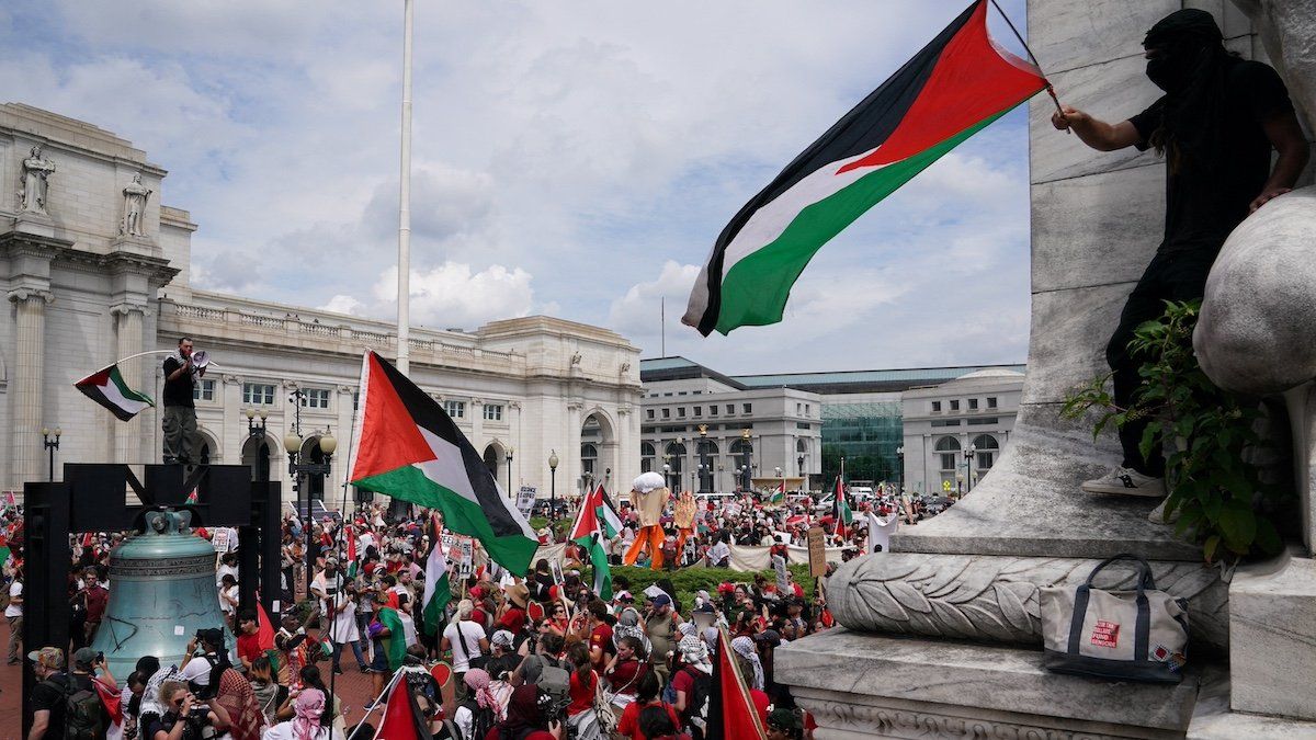 ​Pro-Palestinian demonstrators wave Palestinian flags outside Union Station, on the day of Israeli Prime Minister Benjamin Netanyahu's address to a joint meeting of Congress on Capitol Hill, in Washington, U.S., July 24, 2024. 