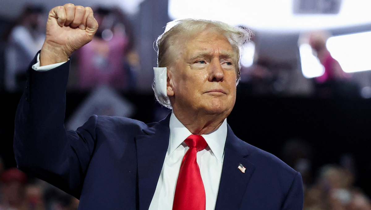 ​Republican presidential nominee and former President Donald Trump raises his fist during Day 1 of the Republican National Convention in Milwaukee, Wisconsin, on July 15, 2024. 