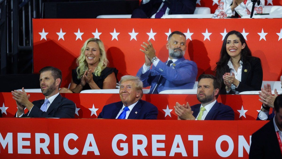 Republican presidential nominee and former U.S. President Donald Trump, Eric Trump and Republican vice presidential nominee J.D. Vance listen as Florida Governor Ron DeSantis speaks on Day 2 of the Republican National Convention (RNC), at the Fiserv Forum in Milwaukee, Wisconsin, U.S., July 16, 2024.