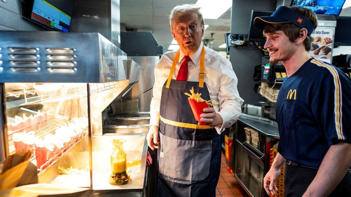 Republican presidential nominee and former U.S. President Donald Trump works behind the counter during a visit to McDonalds in Feasterville-Trevose, Pennsylvania, U.S. October 20, 2024. 