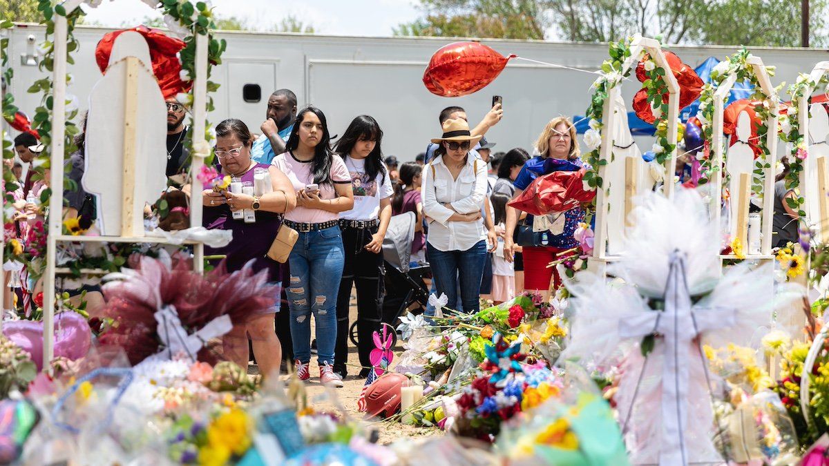 Residents of Uvalde and its surrounding community visit the memorials outside of Robb Elementary School on May 30th, 2022 in Uvalde, TX.