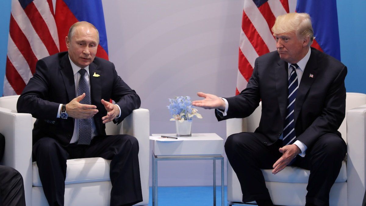 Russia's President Vladimir Putin talks to U.S. President Donald Trump during their bilateral meeting at the G20 summit in Hamburg, Germany July 7, 2017. 