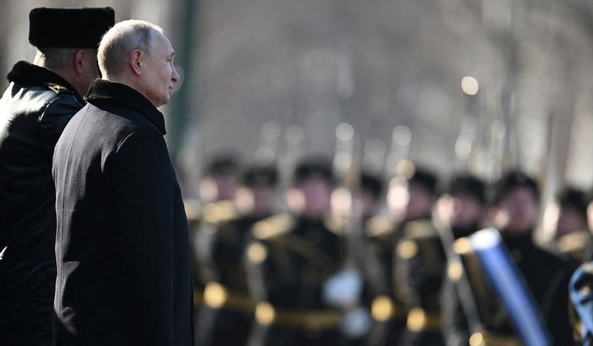 Russian President Vladimir Putin takes part in a wreath-laying ceremony at the Tomb of the Unknown Soldier by the Kremlin Wall on the Defender of the Fatherland Day in Moscow, Russia, Feb. 23, 2023. 