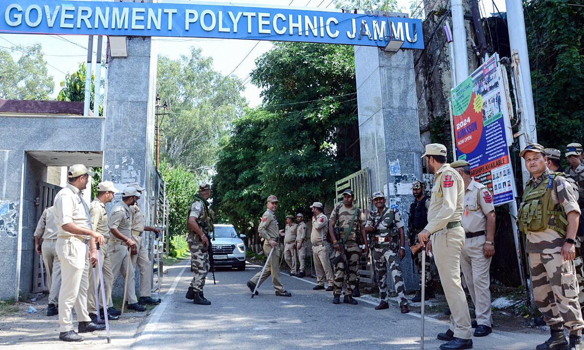 ​Security personnel stand guard ahead of the counting of the Jammu and Kashmir Assembly elections, at Polytechnic College in Jammu on Monday.