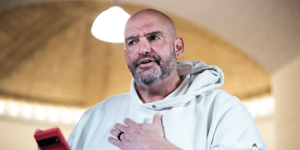 ​Sen. John Fetterman, D-Pa., talks with reporters in Russell building after a senate vote on Wednesday, February 19, 2025.