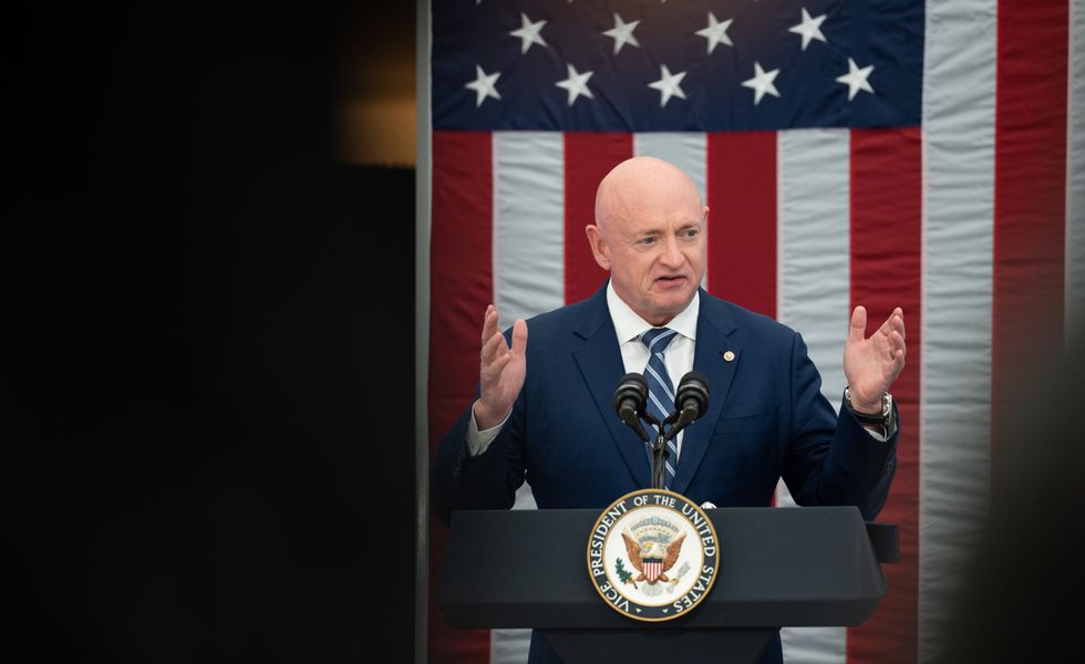 Sen. Mark Kelly, D-Ariz., introduces Vice President Kamala Harris at the first meeting of the National Space Council, United States Institute of Peace, Washington, Dec. 1, 2021.