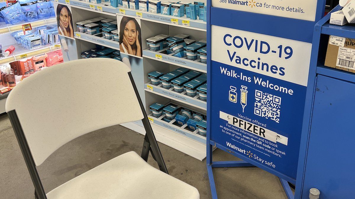 Sign at a Walmart store informing customers that they can get their COVID-19 vaccine or a COVID-19 antigen test in Toronto, Ontario, Canada, on March 11, 2023. 