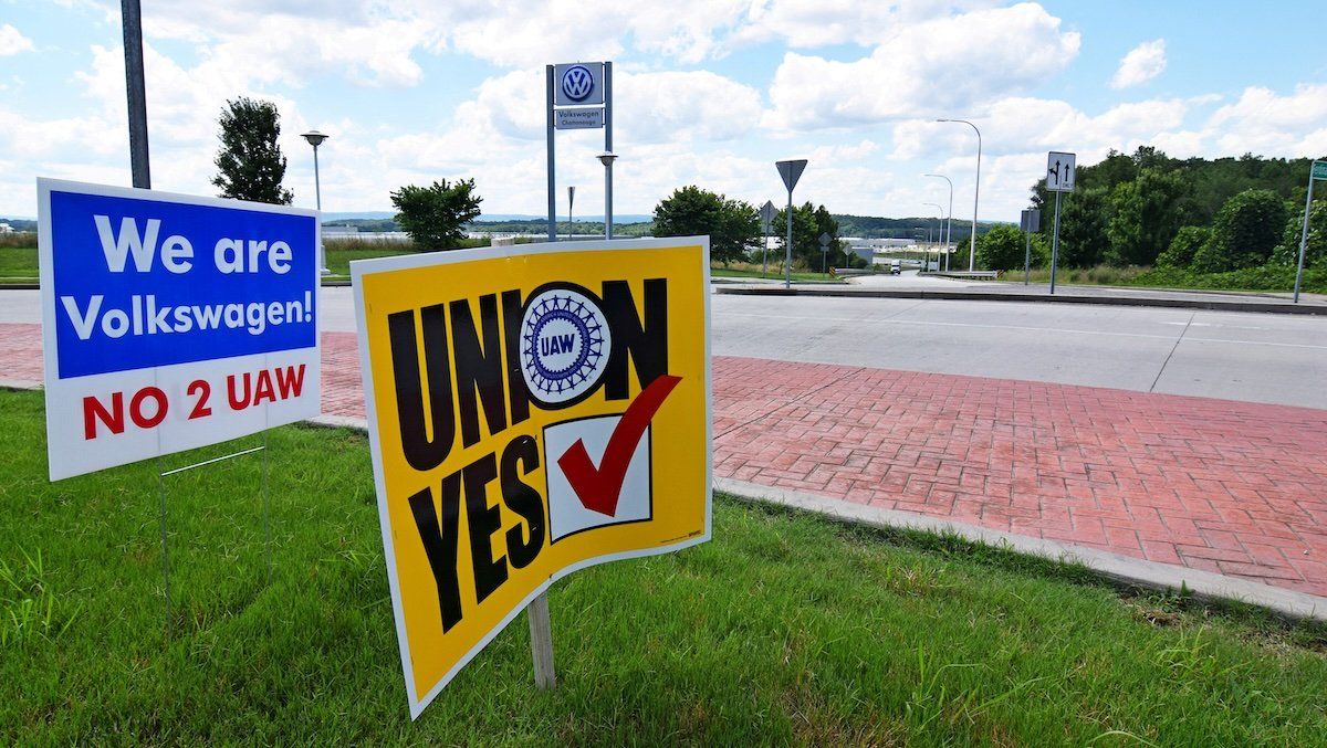 Signs stand outside a Volkswagen plant during a vote among local workers over whether or not to be represented by the United Auto Workers union in Chattanooga, Tennessee, June 13, 2019.