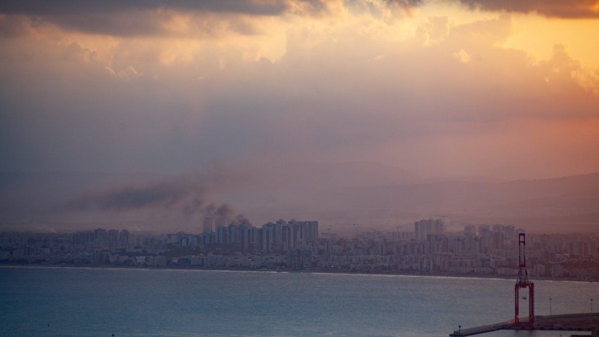 ​Smoke rises in a suburb north of the city of Haifa, Israel, following the apparent strike of a rocket fired from Lebanon on September 22, 2024. 