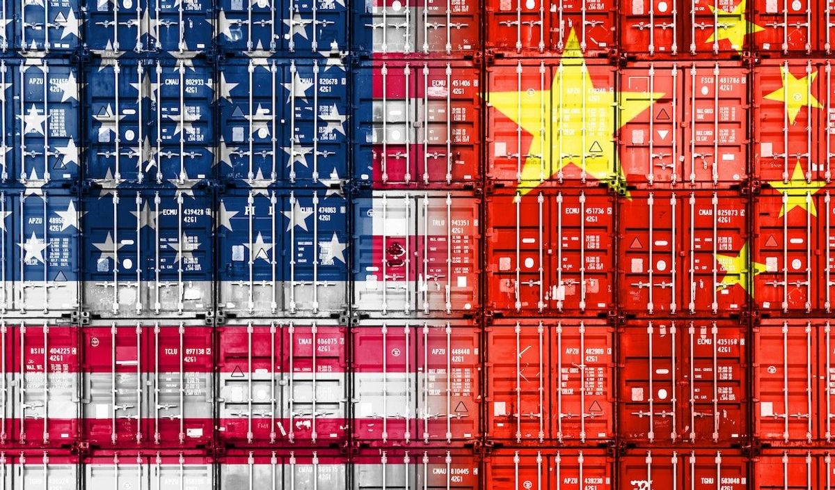 Stacked containers in American and Chinese national colors symbolize a trade war between the US and China. 